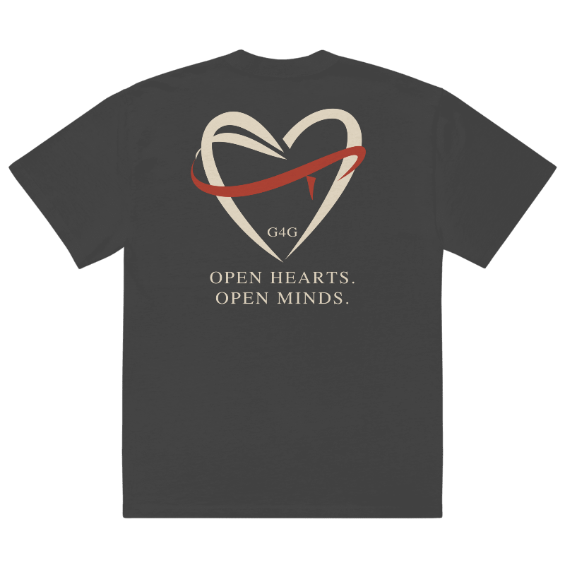 Open Hearts Club faded black oversized tee, back with ivory ribbon heart, brick red ribbon and Open Hearts Open Minds lettering